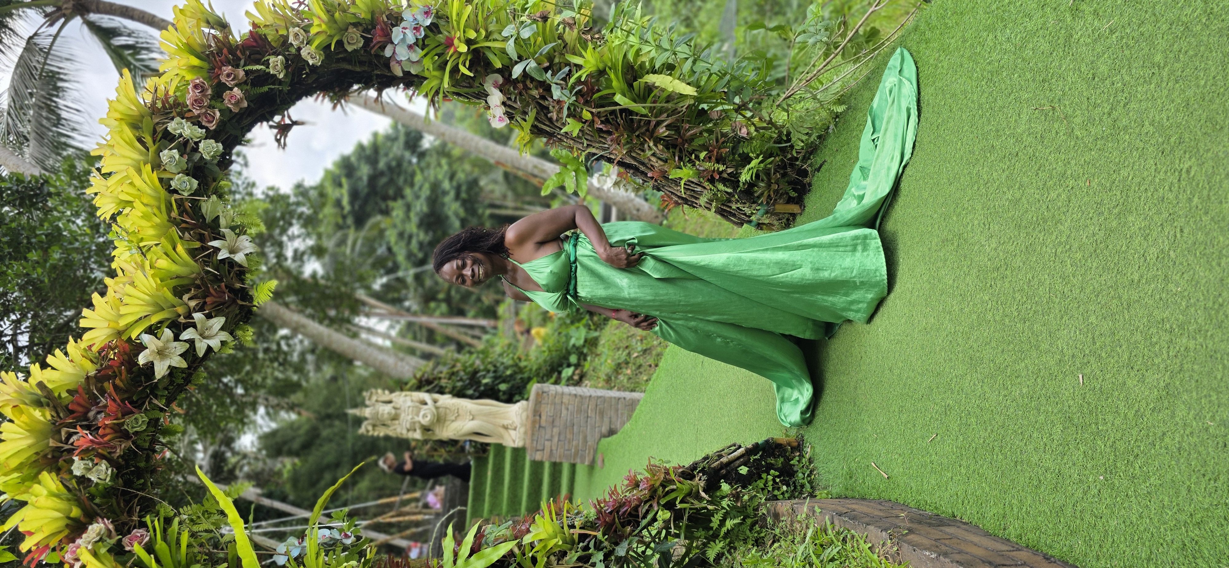 Traveler in a green gown during a Bali trip