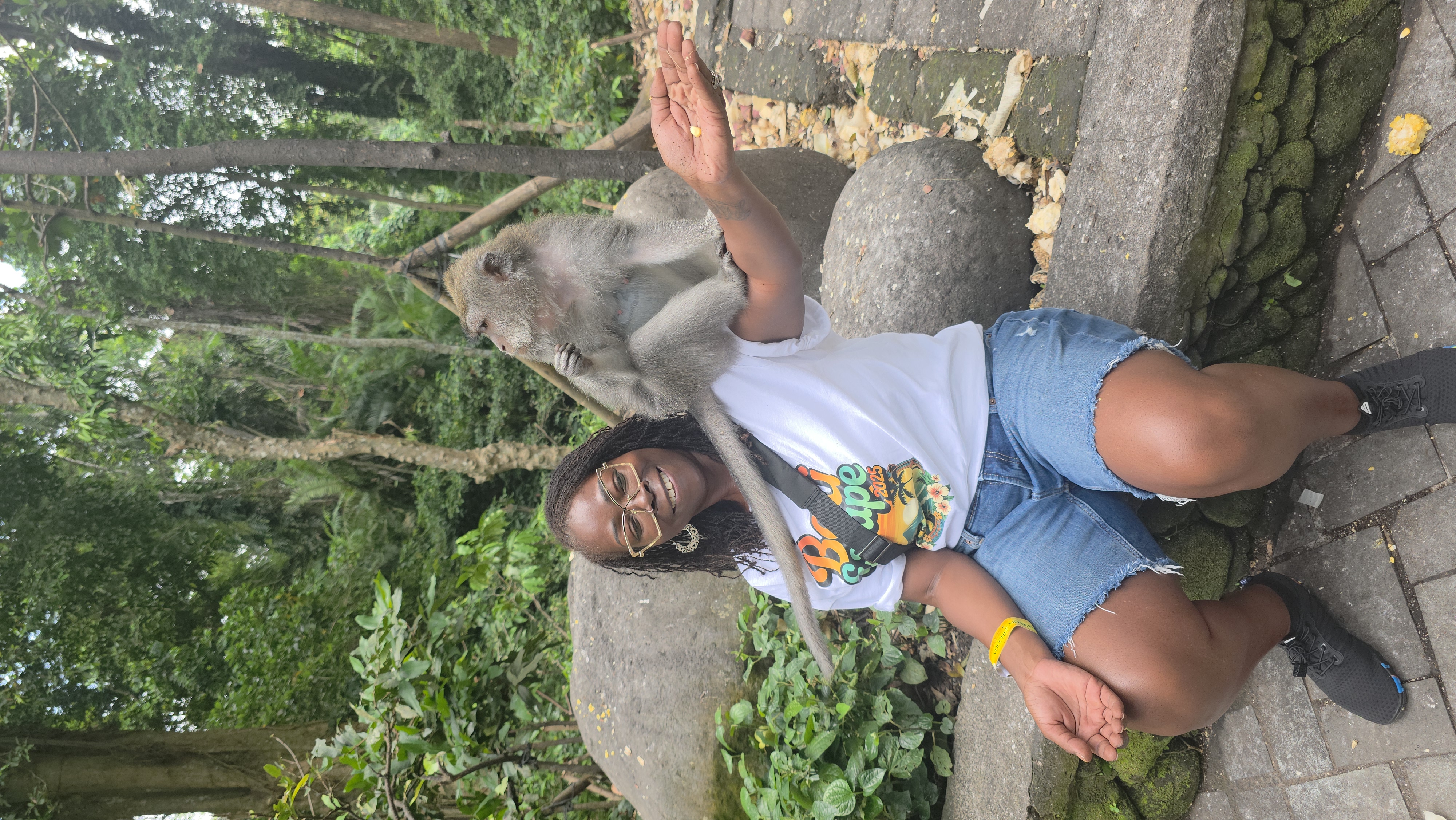 Founder holding monkey in monkey forest during a bali trip